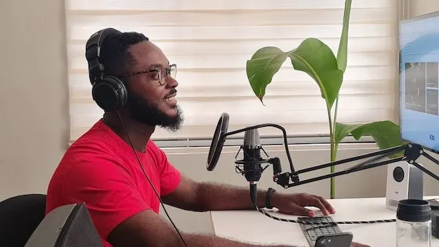 Man recording a podcast episode at a desk